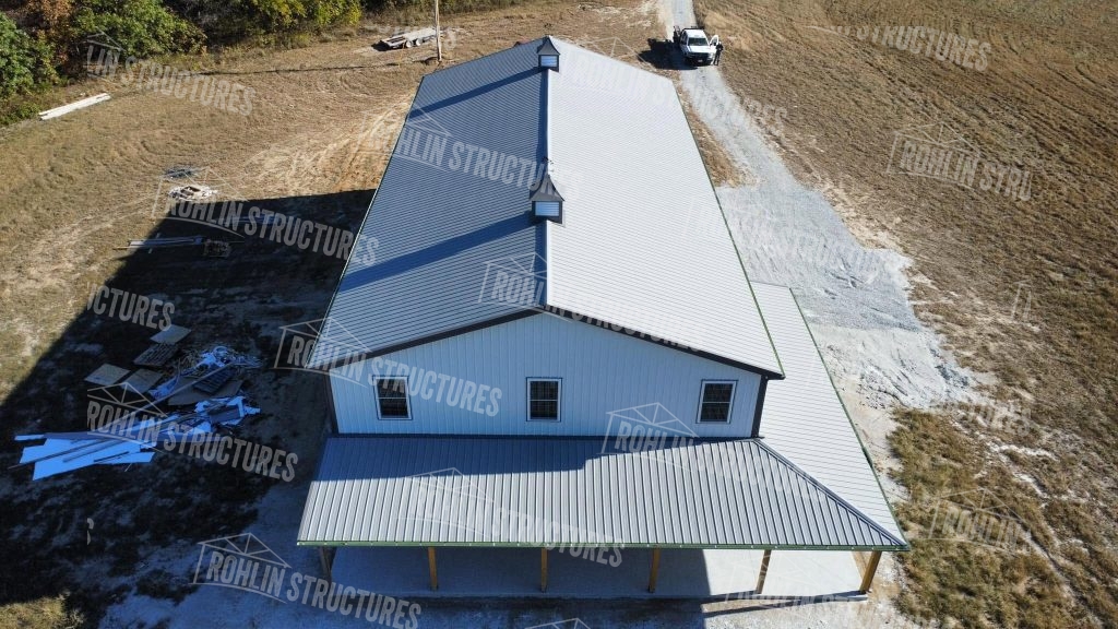 Rohlin Structures Harvest Ridge building package, post-frame structure with wraparound porch and garage, Missouri.