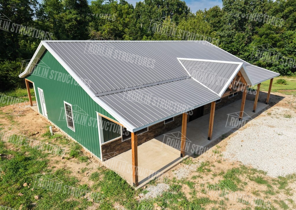 Rohlin Structures custom pole barn and garage with metal roofing and stone accents in Missouri.