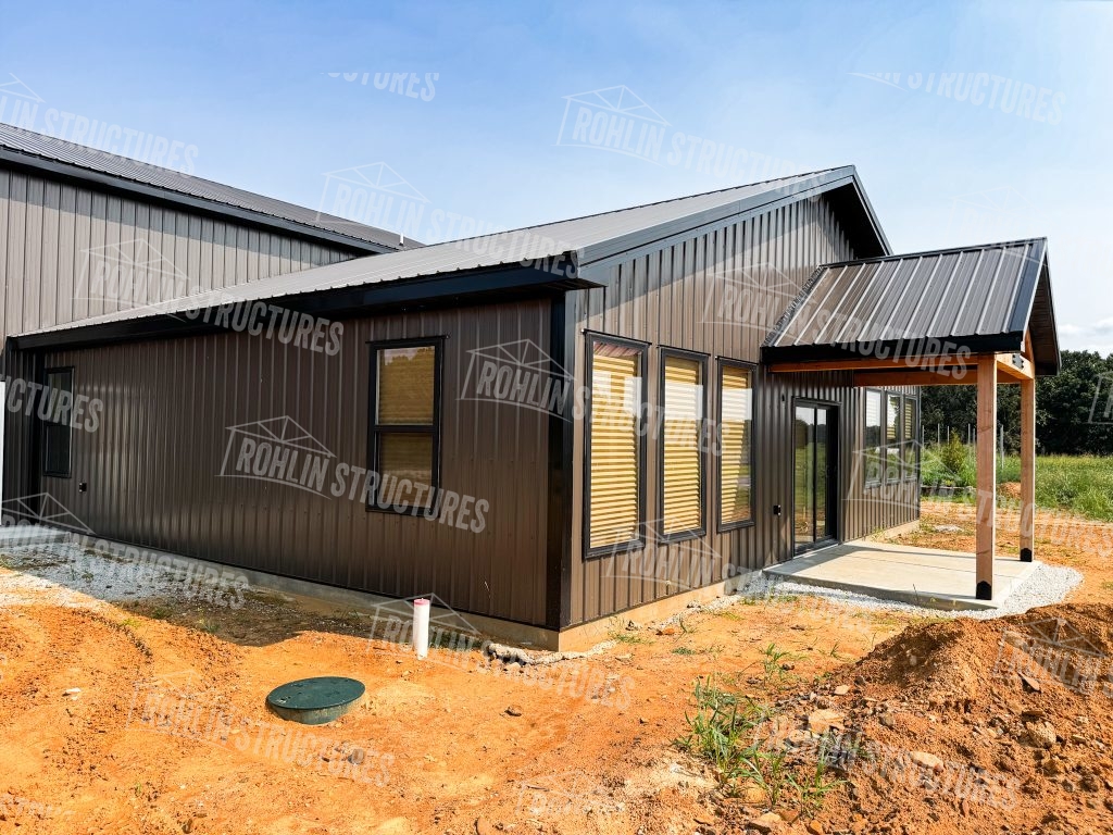 Rohlin Structures barndominium exterior featuring custom porch and metal roofing.