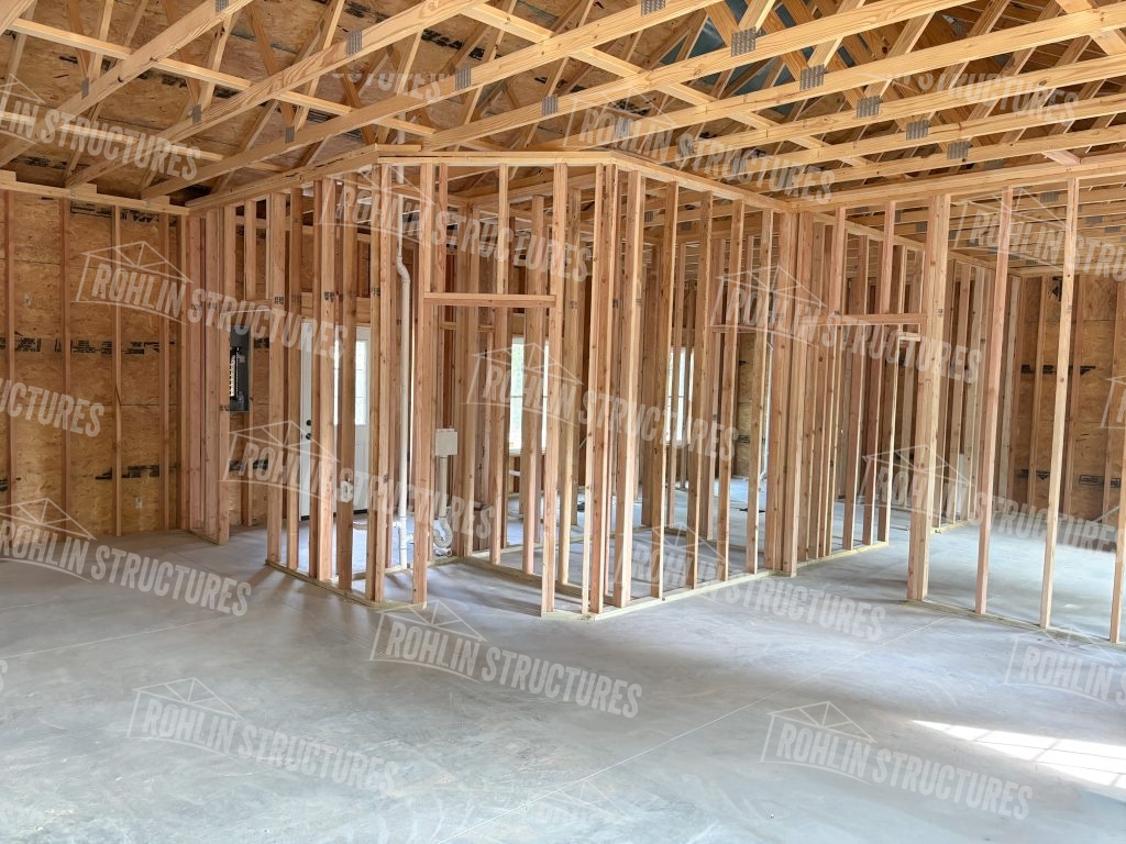 Interior framing of a custom barndominium under construction by Rohlin Structures in Missouri.