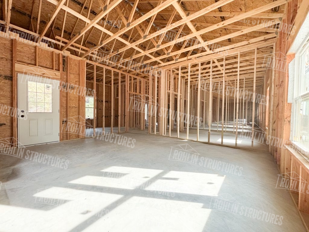 Interior framing of a custom barndominium under construction by Rohlin Structures in Missouri.
