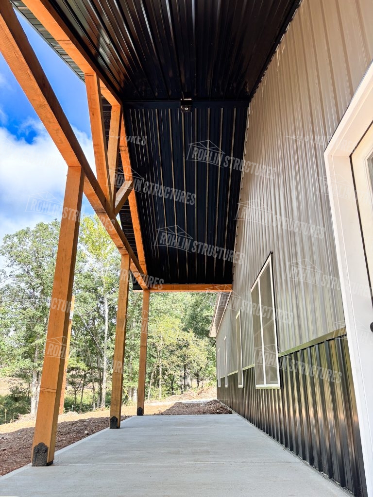Close-up view of a custom barndominium front by Rohlin Structures in Missouri, featuring timber framing.
