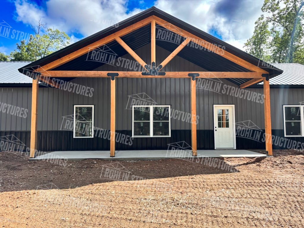 Custom barndominium built by Rohlin Structures in Missouri, showcasing timber framing and a modern design.
