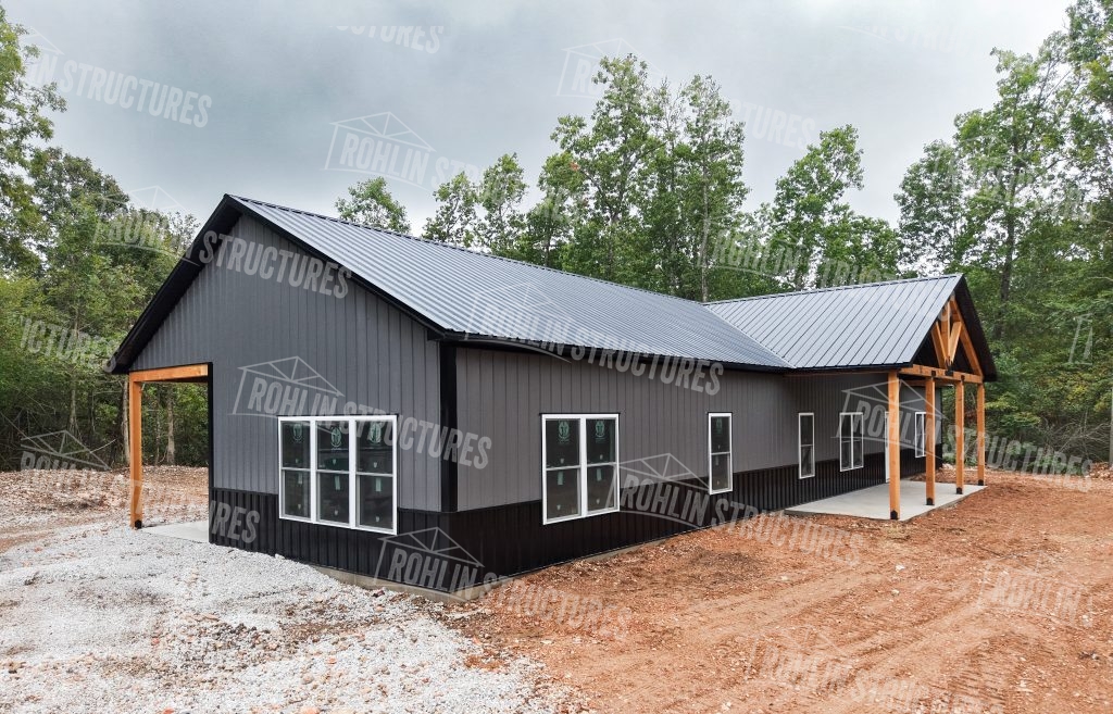 Custom barndominium construction by Rohlin Structures in Missouri, showcasing a modern gray exterior with two porches.