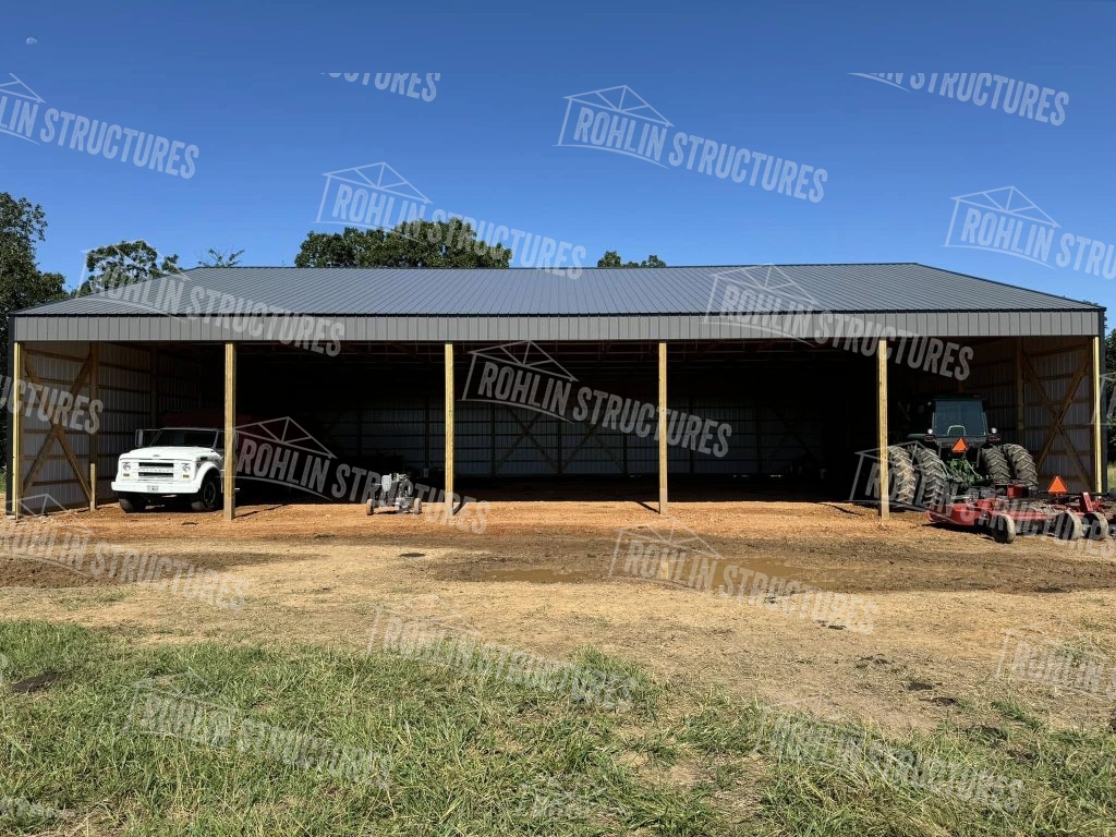 Rohlin Structures equipment cover building featuring a gray metal roof and walls.