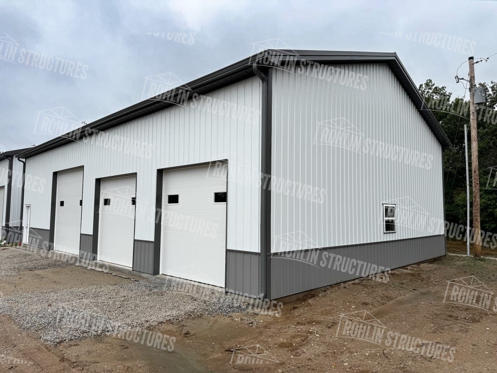 Custom white and grey metal pole barn garage built by Rohlin Structures in Missouri.