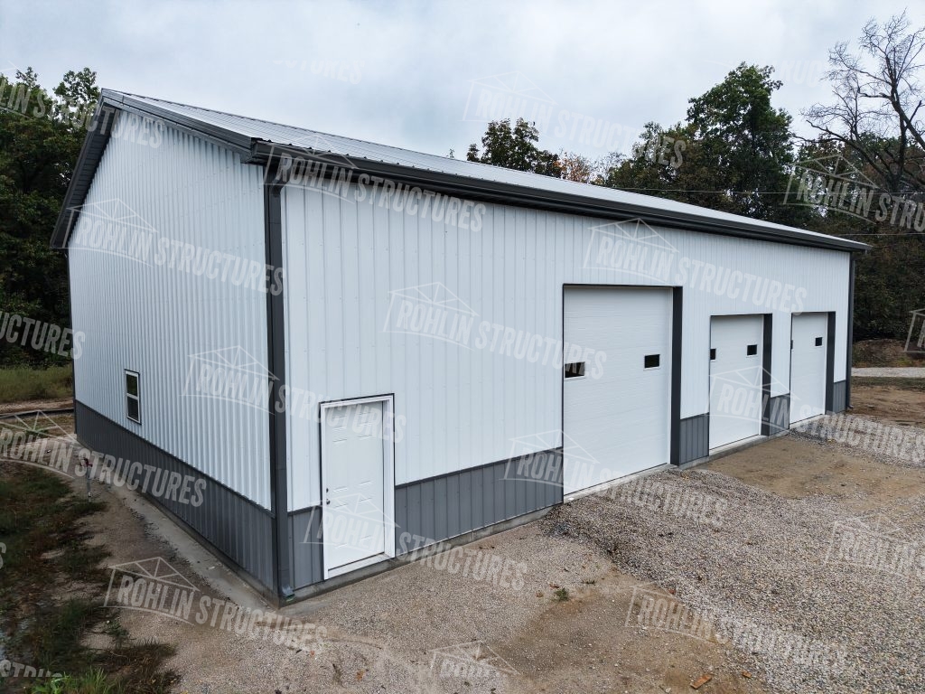 Custom white and gray pole barn built by Rohlin Structures in Missouri.