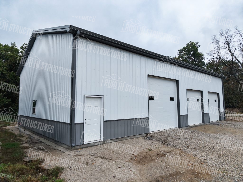 Custom white and gray pole barn built by Rohlin Structures in Missouri.